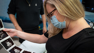 A woman looking at ultrasound images