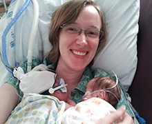 Lola and Mili A mother in a hospital bed with twin babies