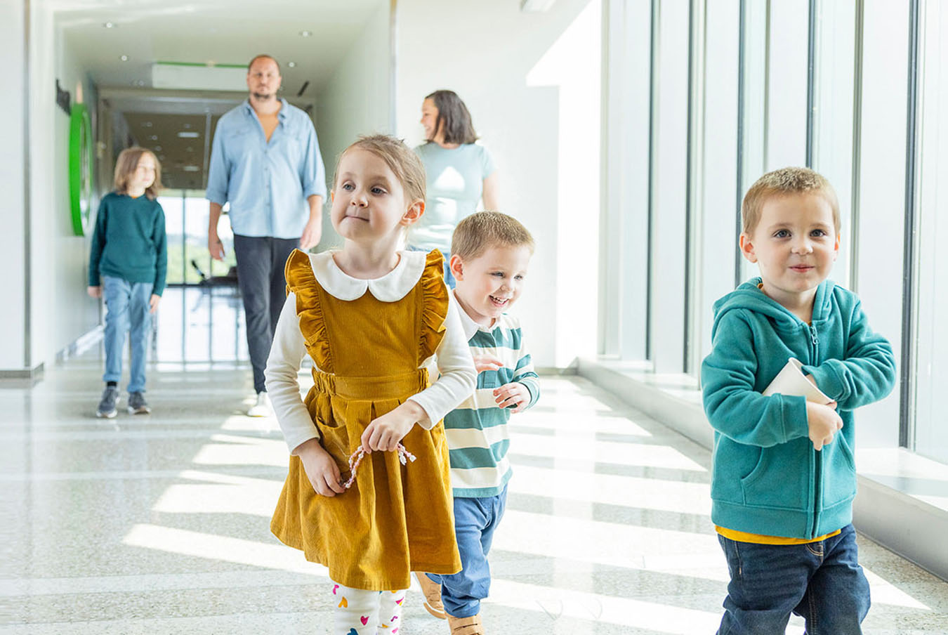 Family walking down corridor