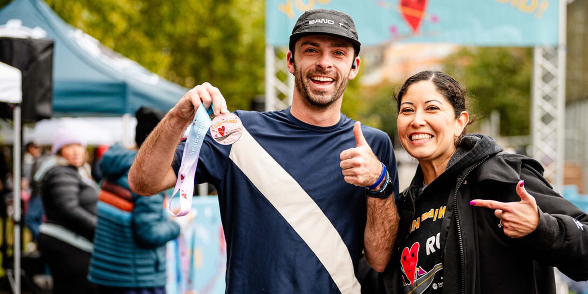 Two race participants pose for a picture