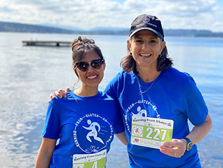 Photo of Aileen with Helene Law at fun run--please include caption: Aileen Kelly (right) with Helene Law, Celiac Guild president, at the guild’s Running From Gluten 5K held in May.