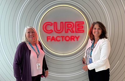 Aileen Kelly (right) and trustee Sue Byers at the Cure Factory.