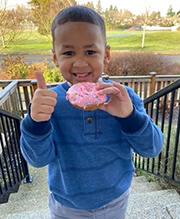 Child holding donut