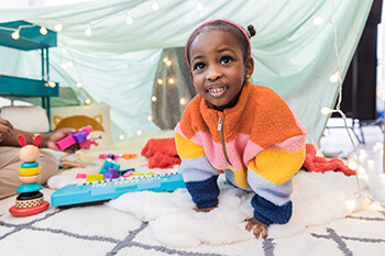 child playing on carpet