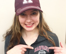 Liesel in Harvard University cap and shirt