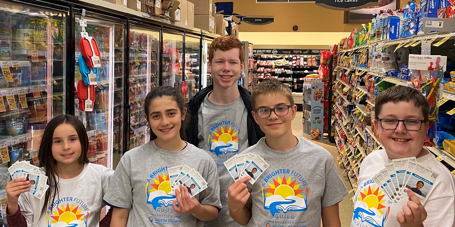 Children pose for a picture in a store
