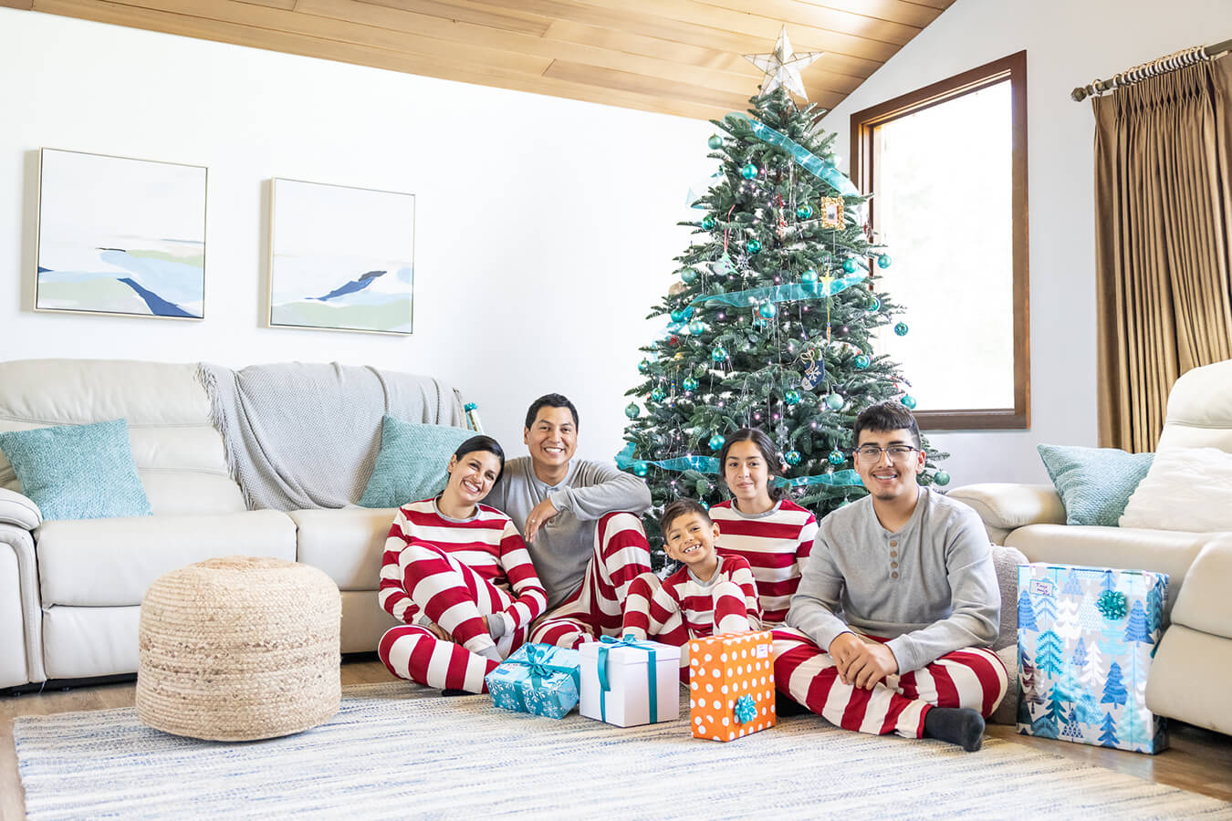 Tiago and his family with Christmas tree