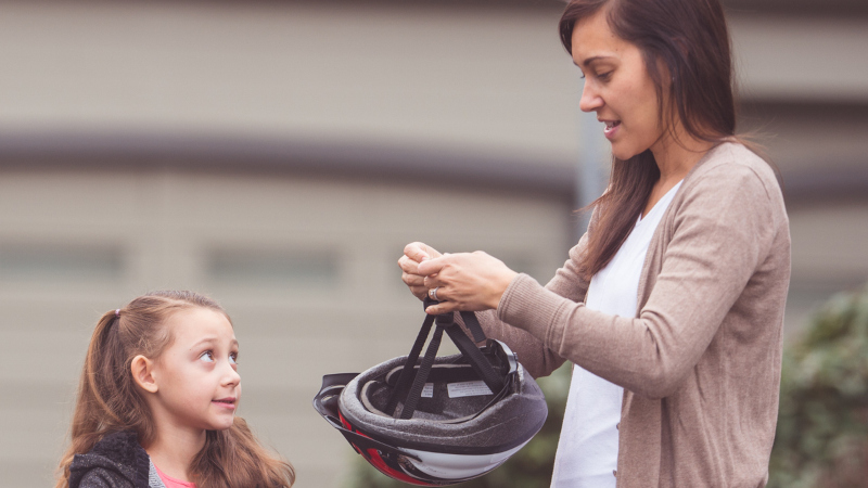 Mother and child with bike helmet