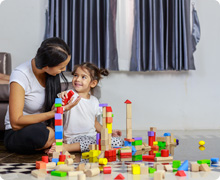 Mom and kiddo playing blocks