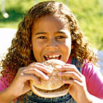 Girl eating a hamburger