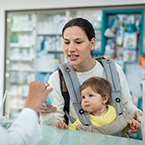 child and parent at pharmacy