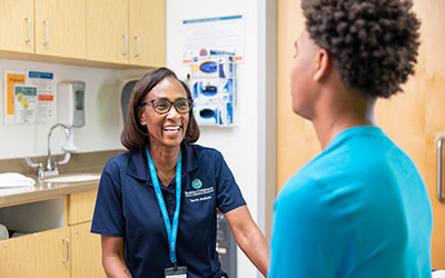 A Seattle Children's provider speaks to a teen patient