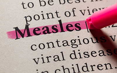 Pen highlighting the word "measles"