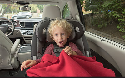 A child in a rear-facing car seat