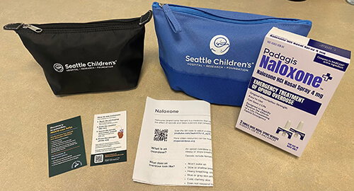 Contents of a naloxone kit spread out on a table