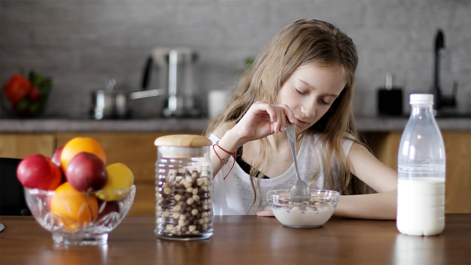 Girl stirring bowl of cereal
