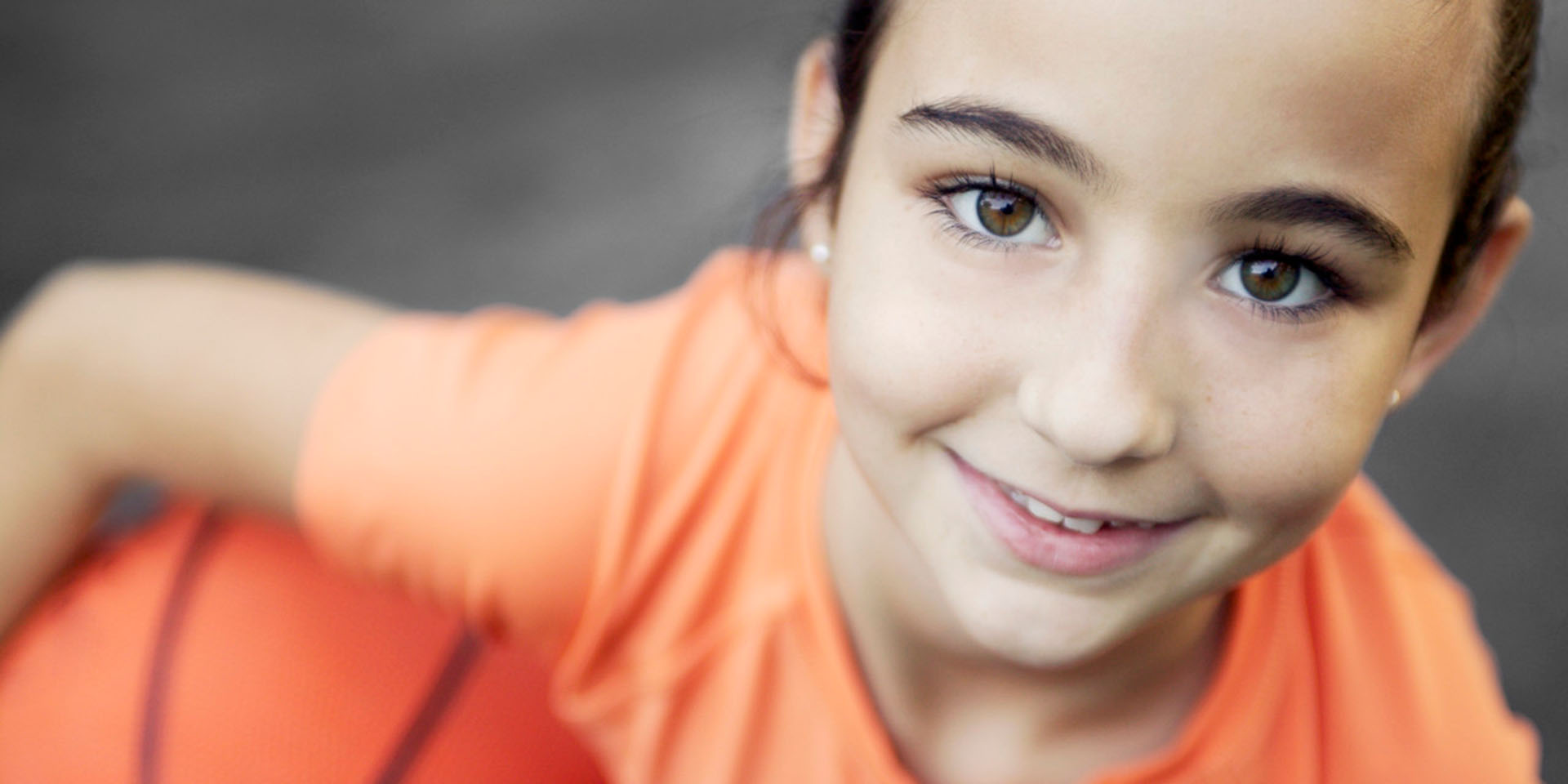 A girl holding a basketball