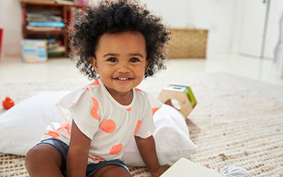 A toddler on the floor