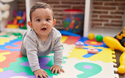 A baby on a mat