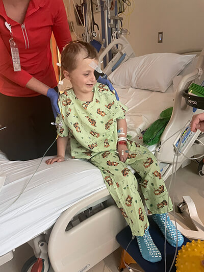 Declan sitting up after surgery
