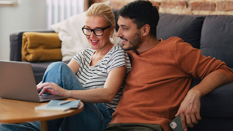 Parents look at a laptop