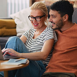 Parents look at a laptop