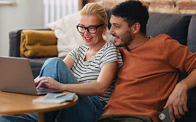 Parents look at a laptop