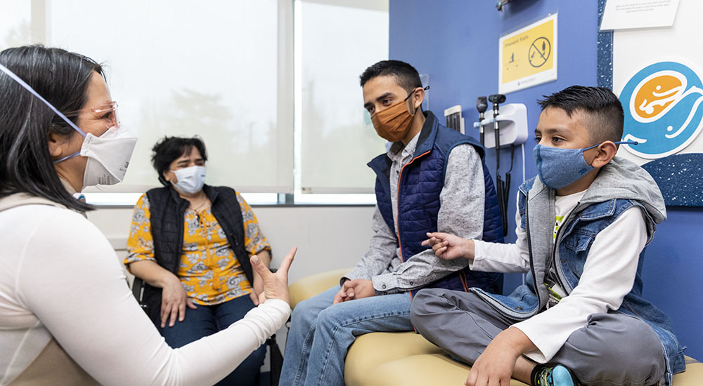 Dr. Evelyn Hsu with the Hurtado family