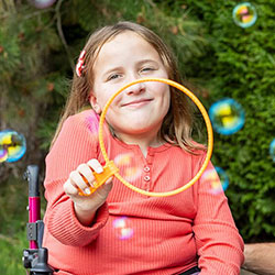 A girl blowing bubbles
