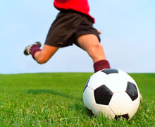 Kiddo kicking a soccer ball