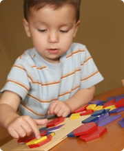 kiddo playing with a puzzle