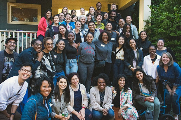 Seattle Children's residents pose on the steps of a house.