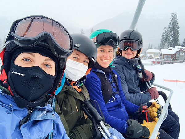 Residents sit on a chair lift