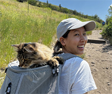 Dr. Daphne Cheng hiking with her cat