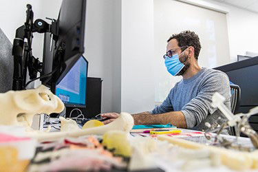 A researcher at a computer