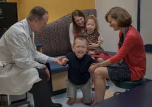 A boy and his family with a Seattle Children's doctor