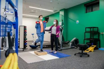 A patient recieves physical therapy at OBCC
