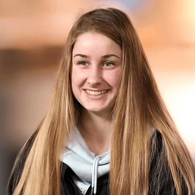 A teen girl posing for a picture