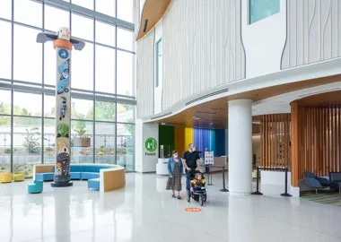 A family walks through the lobby of Forest B