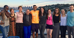 Residents pose together with Lake Union and the Seattle skyline behind them
