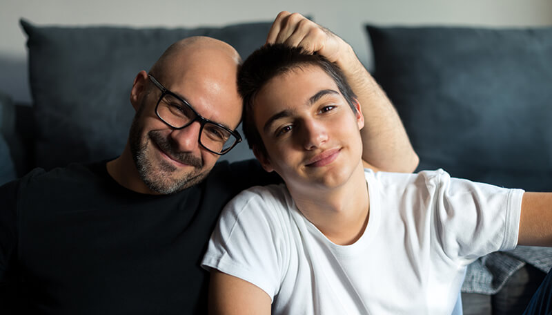 A teenage boy and his father