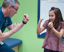 Dr. David Suskind playing with a patient