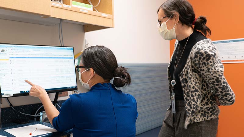 Two Seattle Children's employees review information