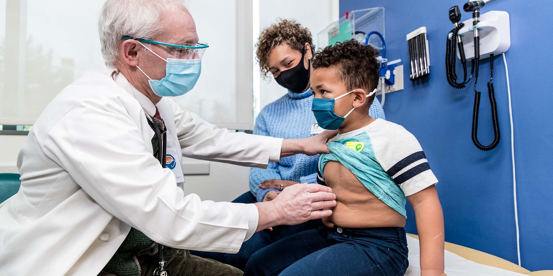 A doctor examines a boy at Seattle Children's