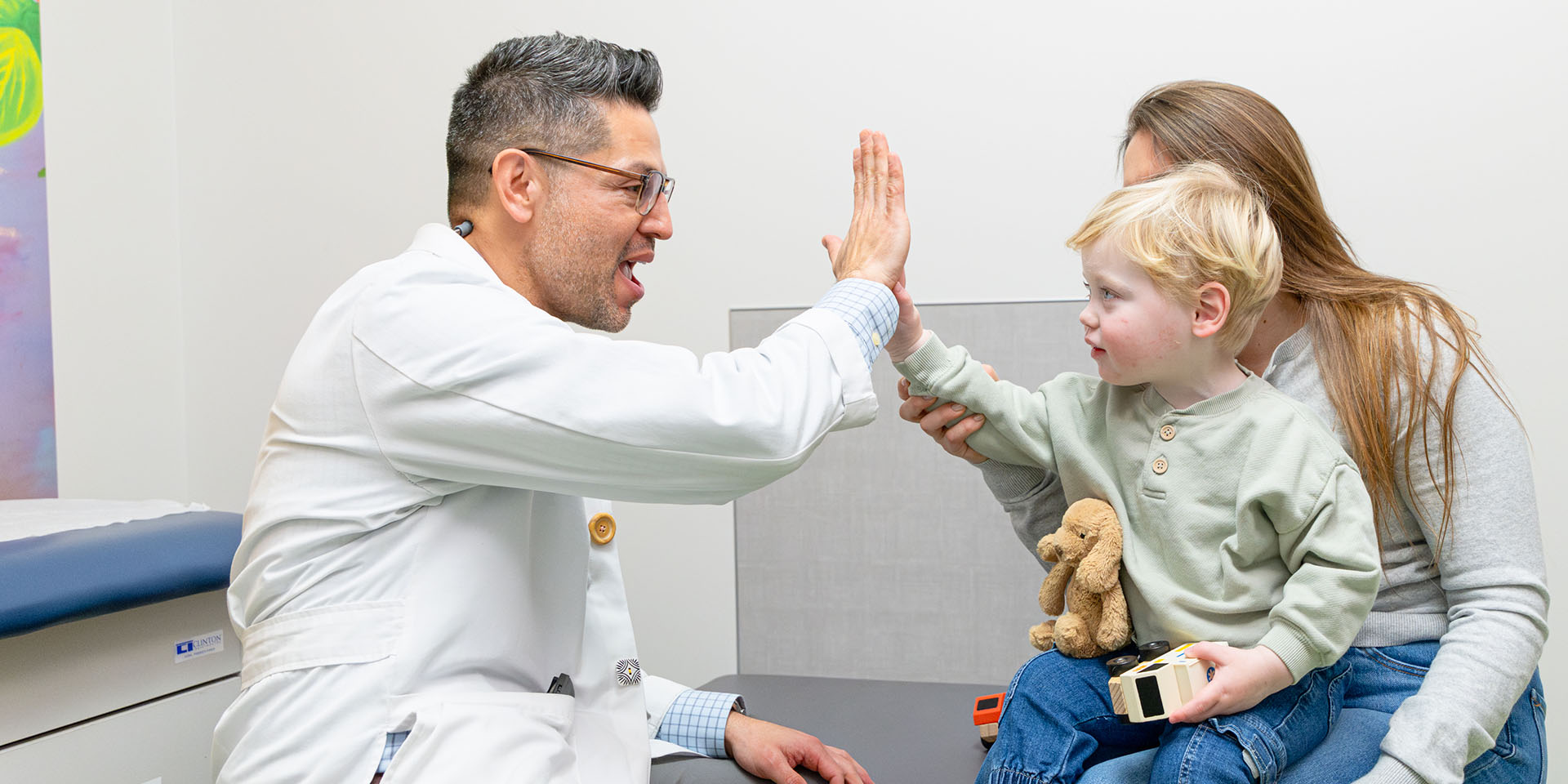 Dr. Jason McKerry cares for Richmond Pediatrics patient and caregiver.