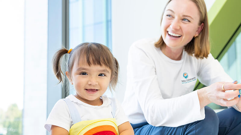 Girl with Seattle Children's employee