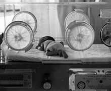 Historic photo of child in the ICU