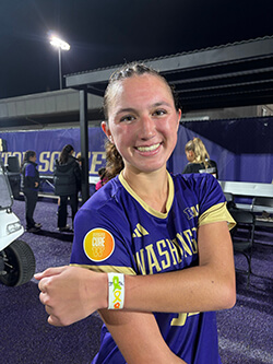 A soccer player shows off her wristband