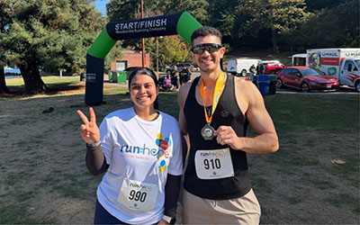  A man and woman pose after a 5k