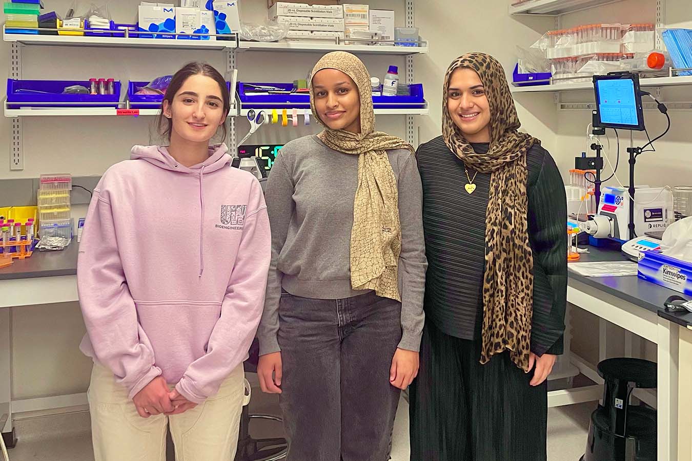 The new MAB student research team standing side-by-side in their lab, ready to begin their work.